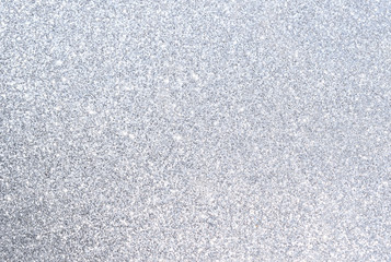 sparkles of silver glitter abstract background