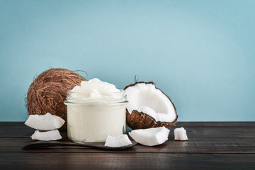 Coconut cream in a glass jar with fresh coconut