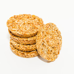 Healthy diet snack close-up. Cereal cookies with nuts isolated on a white background. 