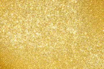 sparkles of golden glitter abstract background	