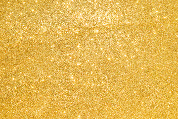 sparkles of golden glitter abstract background	