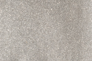 sparkles of silver glitter abstract background