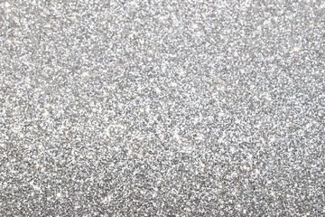 sparkles of silver glitter abstract background