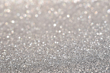sparkles of silver glitter abstract background