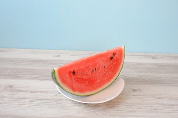 Watermelon on the table. Watermelon on a plate. テーブルの上のスイカ。皿の上のスイカ。