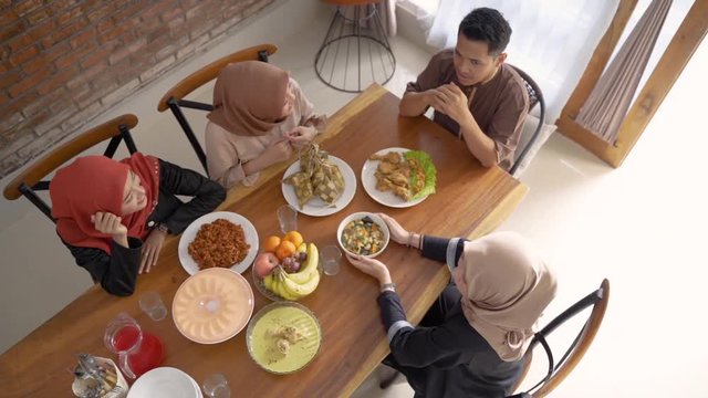 top view of people muslim having their food together with family