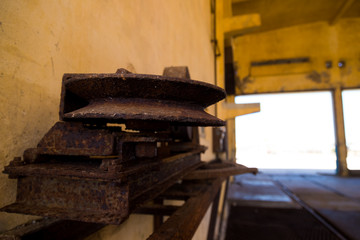 Macro close-up of rusty pulley in a mechanical workshop