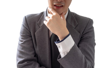 Happy young businessman in suit looking at camera on white background, isolated concept