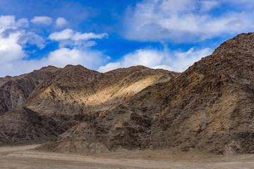 Panorama of the beautiful mountains that surround Leh at sunlight - Ladakh, Jammu and Kashmir, India.