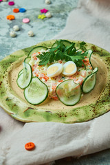 Children's salad with crab and cucumber slices 