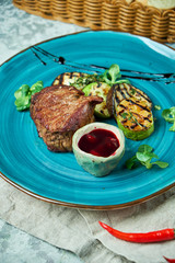Steak with barbecue vegetables and lingonberry sauce