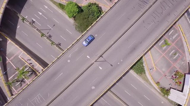 Beautiful ascending aerial shot of roundabout and roads with traffic in Medellin