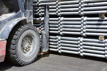 Scaffolding Material Yard :Loading a scaffolding pillars with a forklift