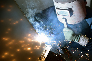 Arc welding work at a back street factory in Japan: Welding while protecting with handle welding...