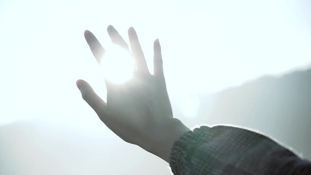 Covering the sun with hand stock footage