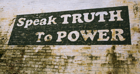 Painted sign on wall in Culpeper Virginia "Speak Truth to Power"