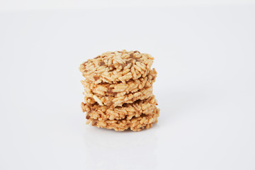 Thai Sweet Crispy Rice Cakes with Cane Sugar Drizzle, on white background
