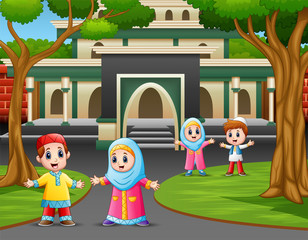 Obraz na płótnie Canvas Cartoon of muslim kids in front the mosque