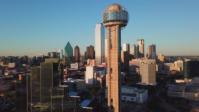 Aerial Drone footage of Downtown Dallas Skyline and Reunion Tower at Sunset Golden Hour