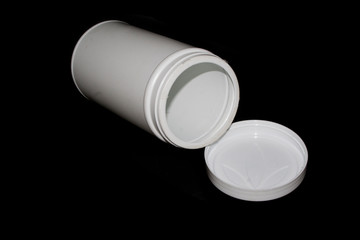 plastic can isolated on black background