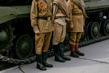 VERKHNYAYA PYSHMA, RUSSIA - 9 MAY 2019: The clothes of a Soviet soldier during the great Patriotic war with fascist 1941-1945, boots and puttees - obrazy, fototapety, plakaty