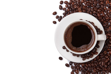 A cup of coffee and coffee beans isolated on white background.