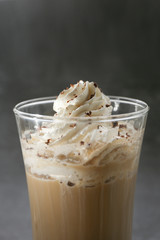 ice Viennese coffee in a glass on a grey background