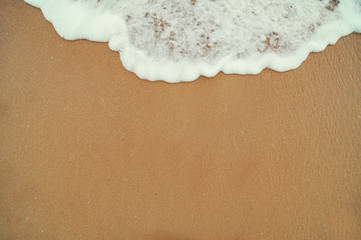 beautiful sandy beach and soft blue ocean wave