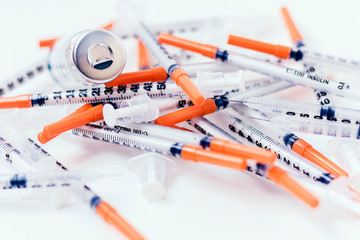 Pile of medical syringes for insulin for diabetes .