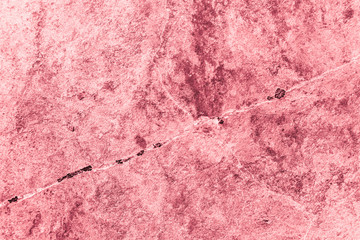 Vintage pink background. Rough painted wall of fiesta color. Imperfect plane of rosy colored. Uneven old decorative toned backdrop of rouge tint. Texture of pink hue. Ornamental stony surface.