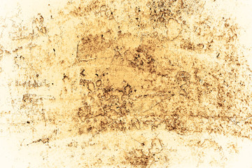 Vintage yellow background. Rough painted wall of aspen gold color. Imperfect plane of golden colored. Uneven old decorative toned backdrop of yellow tint. Texture of gold hue. Ornamental stony surface