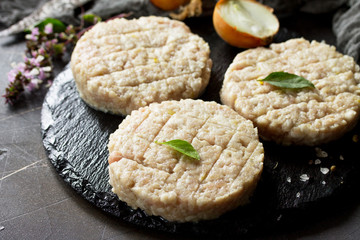 Raw fresh cutlets burger from beef for homemade burgers cooking with spices close-up.