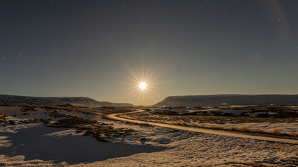 Godafoss, Akureyri, Iceland Dec 21 2018: moon setting near godafoss waterfalls