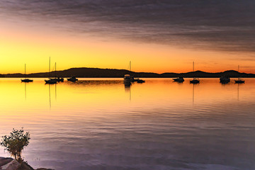High Clouds, Boats, Reflections and Sunrise on the Bay