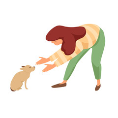 the girl reaches out to the little puppy. scared puppy. taming a pet