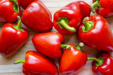 Fresh red pepper over wooden background
