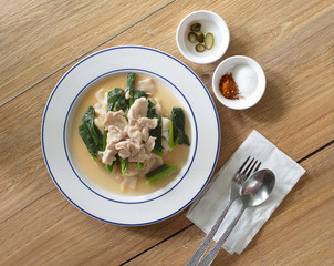 Noodle topping in white dish with seasoning, Select focus and space for texts.