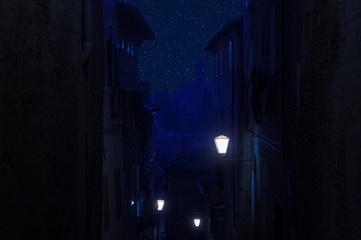 Night sky with stars over ancient town