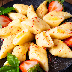 Kopytka - polish potato dumpling with strawberries