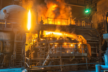 operator working in metallurgical engineering at manufactory of steel plant  