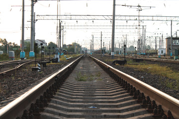 Fototapeta na wymiar Train rails during sunset in summer day
