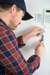 Fototapeta na wymiar installing a programmable room thermostat