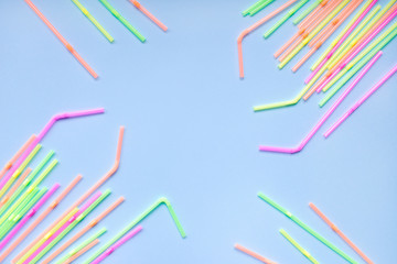 Colourful plastic straws on blue background. Cocktail tubes. Place for your text. Say no plastics. Plastic free concept.