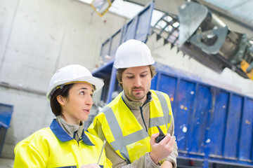 male and female engineers working in a power plant