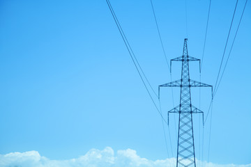 Power line at the blue sky. High voltage towers