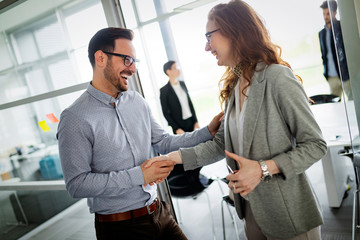 Business people shaking hands, finishing up meeting