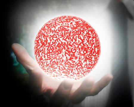 Big data concept. Male hand holding self-illuminated red ball of huge amount 3d letters and numbers with white light.