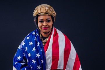 afro american army latin soldier in camouflage clothes hair dreadlocks evening makeup and big lips on a black background in the studio with american flag,independence day usa 4th of july