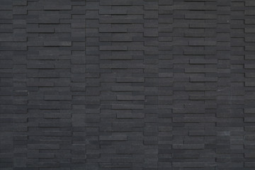 black brick wall of dark stone texture and background