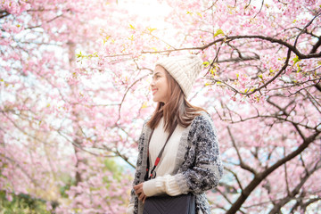 Attractive woman is enjoying  with  Cherry Blossom in Matsuda , Japan